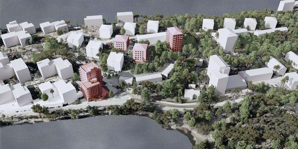 3D illustration. Flygvy över Ekensberg från söder med Gröndalsvägen i förgrunden. Befintliga byggnader är illustrerade med vita kuber och föreslagen bebyggelse är markerad med röd färg.